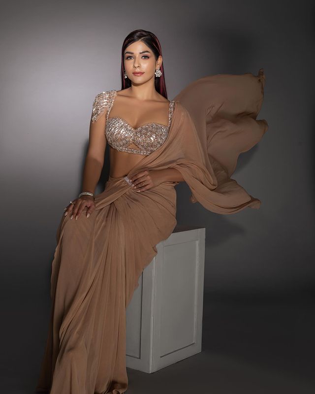 Divya Sharma in Nude Drape Saree With Bralette Blouse & Tasseled Sleeves