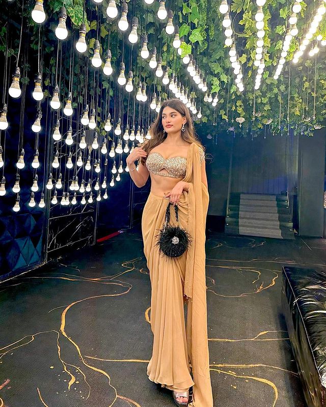 Medha Das Sharma in Nude Drape Saree With Bralette Blouse & Tasseled Sleeves