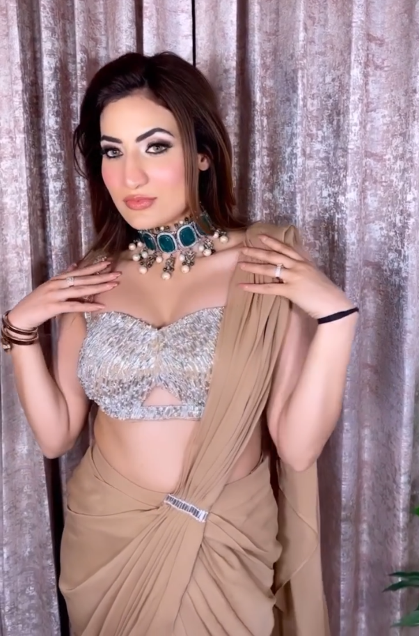 Gurpreet Kaur in Nude Drape Saree With Bralette Blouse & Tasseled Sleeves