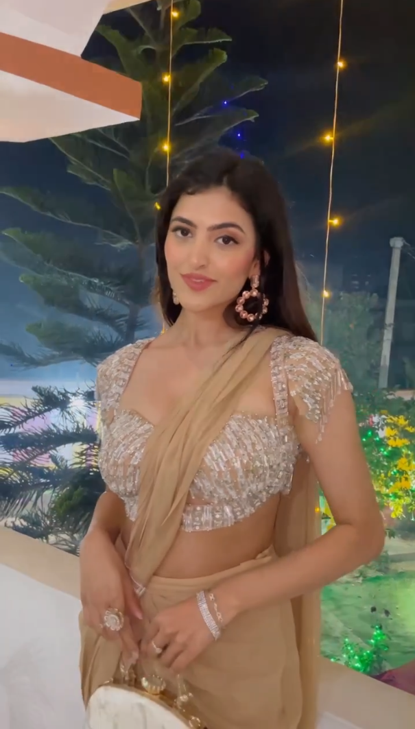 Snigdha in Nude Drape Saree With Bralette Blouse & Tasseled Sleeves